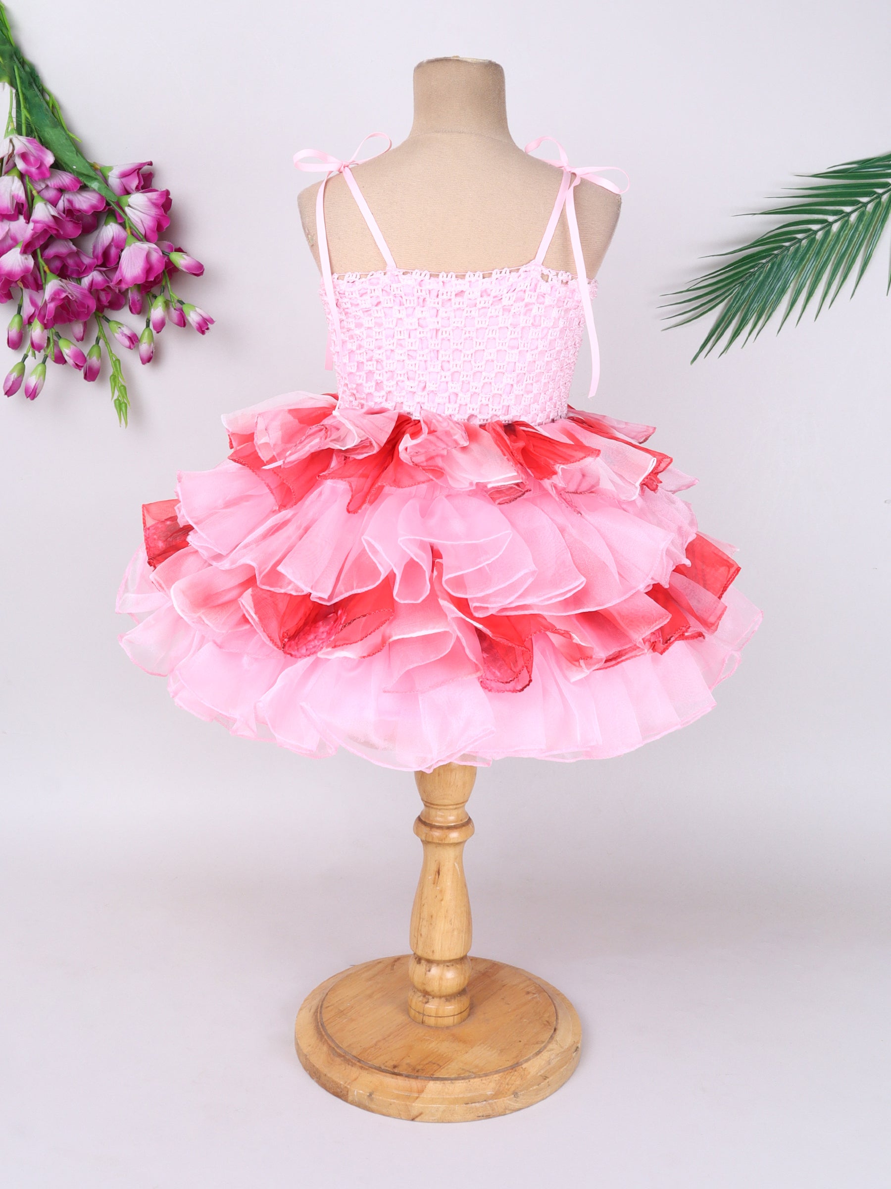 "Layered Ruffle Tutu Gown – Striking floral design with a bold butterfly accent, perfect for special occasions."