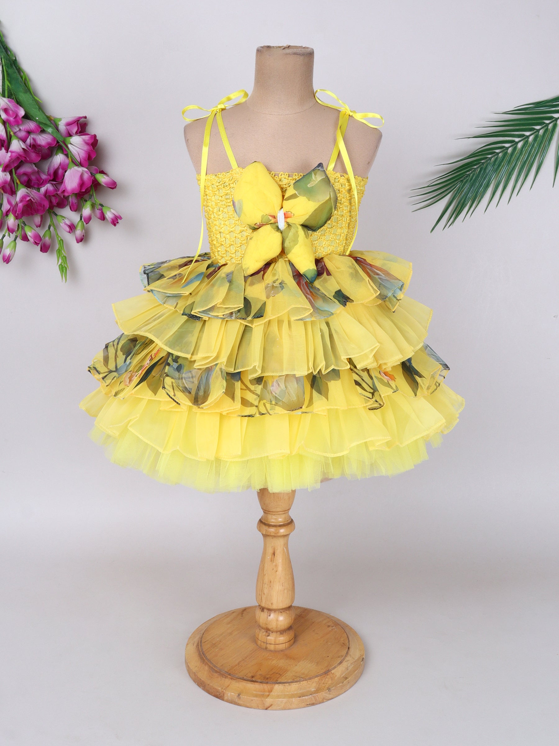 "Layered Ruffle Tutu Gown – Striking floral design with a bold butterfly accent, perfect for special occasions."