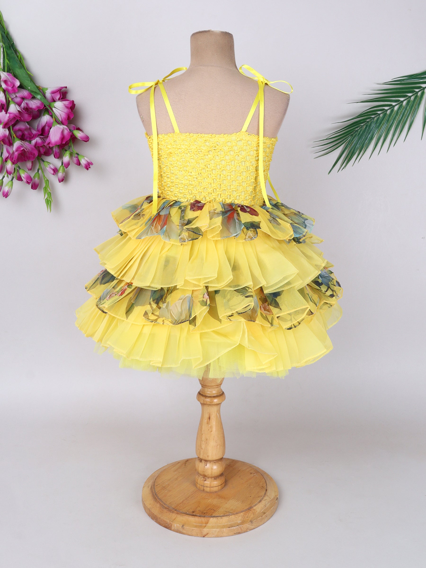"Layered Ruffle Tutu Gown – Striking floral design with a bold butterfly accent, perfect for special occasions."