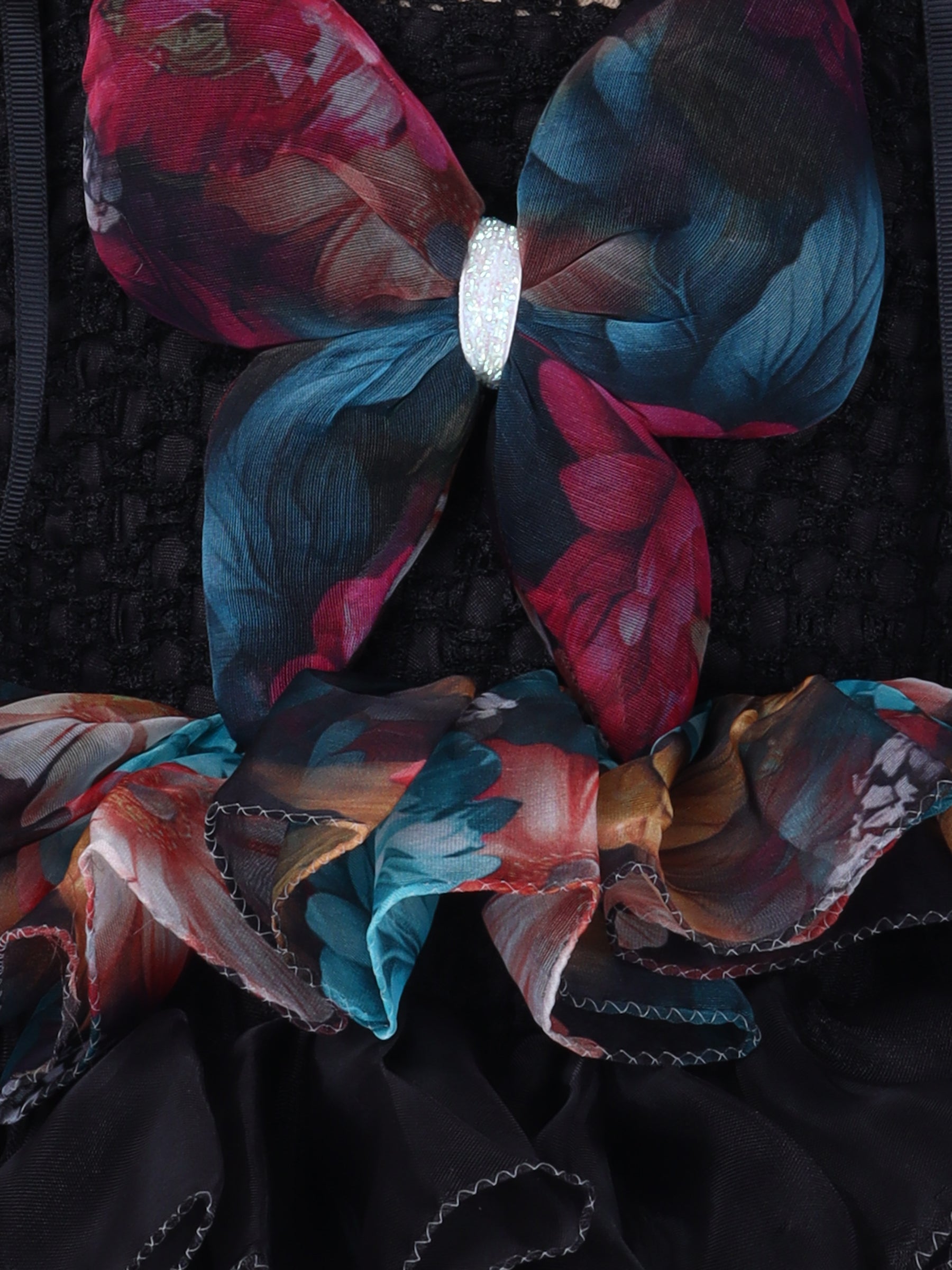 "Layered Ruffle Tutu Gown – Striking floral design with a bold butterfly accent, perfect for special occasions."
