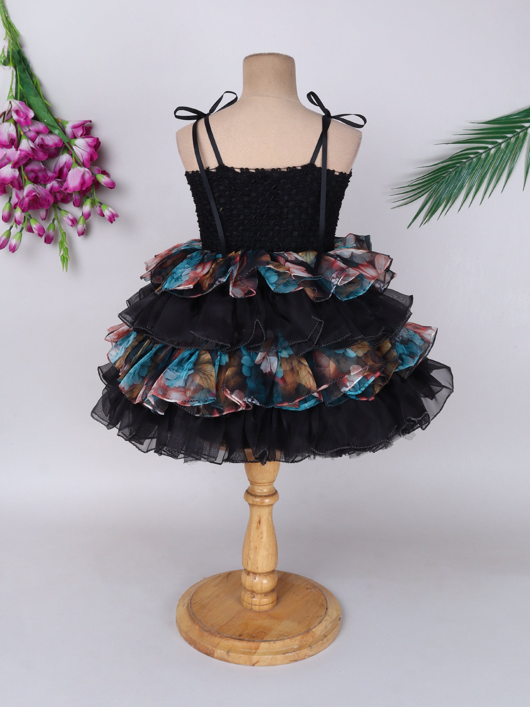 "Layered Ruffle Tutu Gown – Striking floral design with a bold butterfly accent, perfect for special occasions."