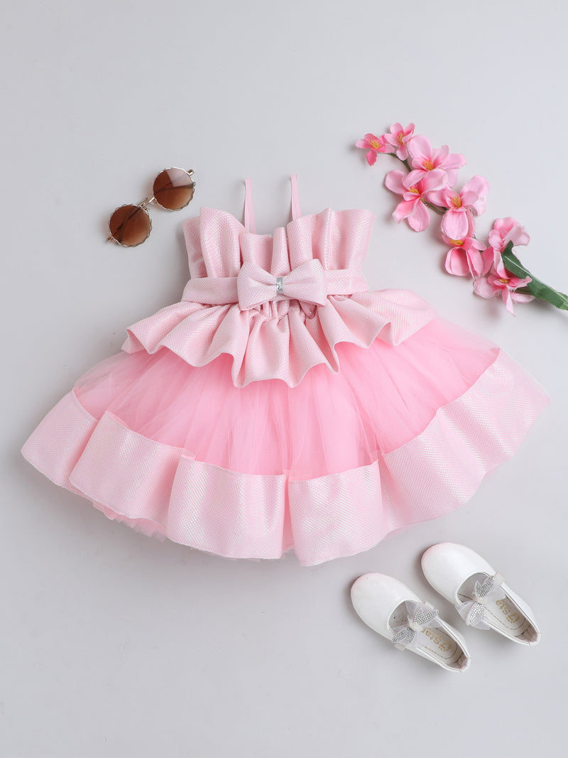 "Dreamy tutu gown featuring a shimmery bow belt, layered ruffles, and delicate straps – perfect for birthdays,