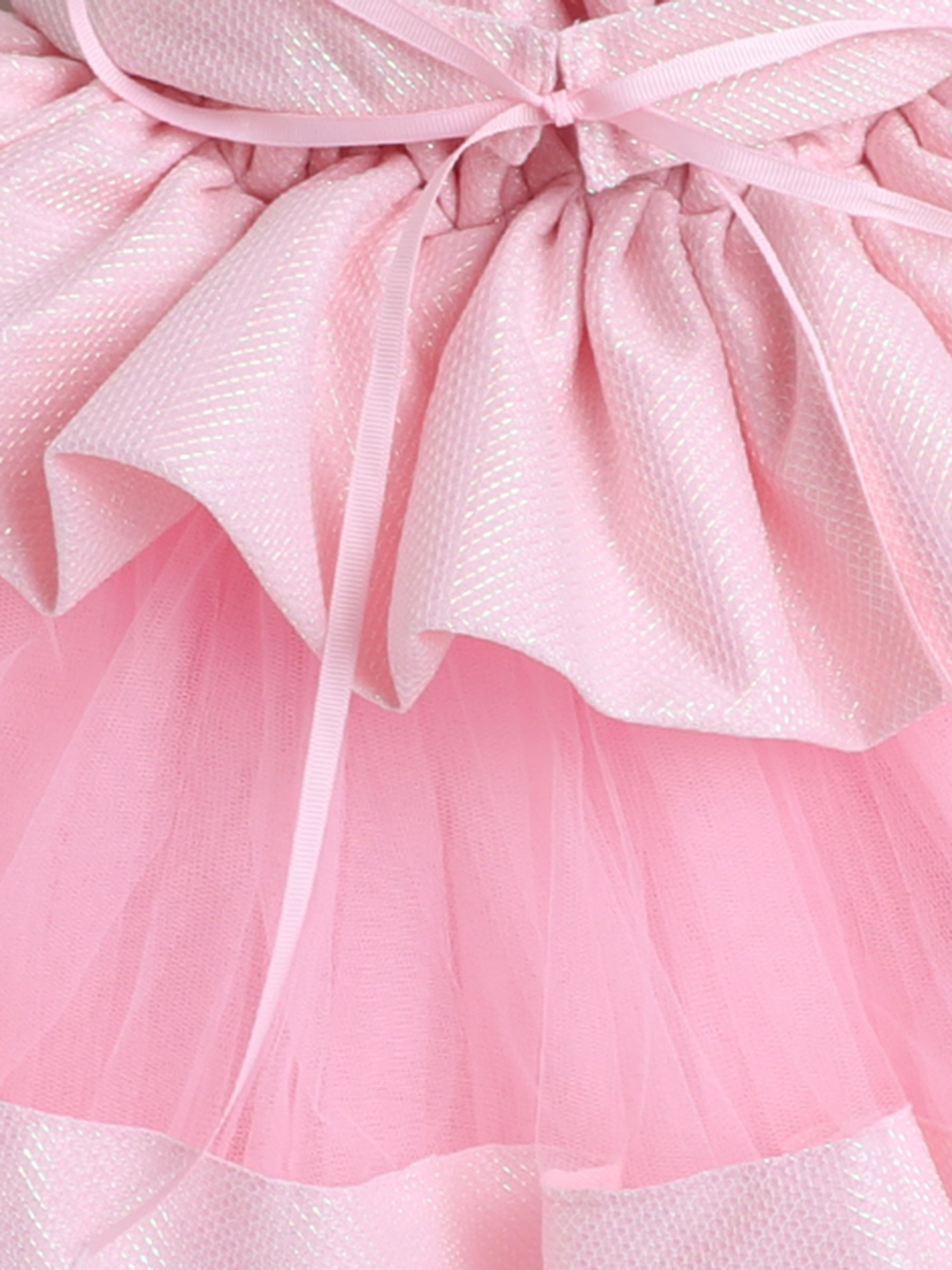 "Dreamy tutu gown featuring a shimmery bow belt, layered ruffles, and delicate straps – perfect for birthdays,