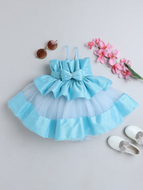 "Dreamy tutu gown featuring a shimmery bow belt, layered ruffles, and delicate straps – perfect for birthdays,