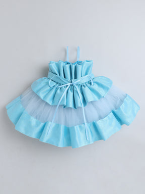 "Dreamy tutu gown featuring a shimmery bow belt, layered ruffles, and delicate straps – perfect for birthdays,