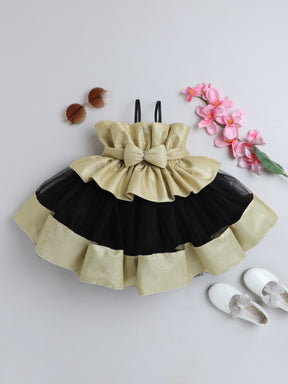 "Dreamy tutu gown featuring a shimmery bow belt, layered ruffles, and delicate straps – perfect for birthdays,