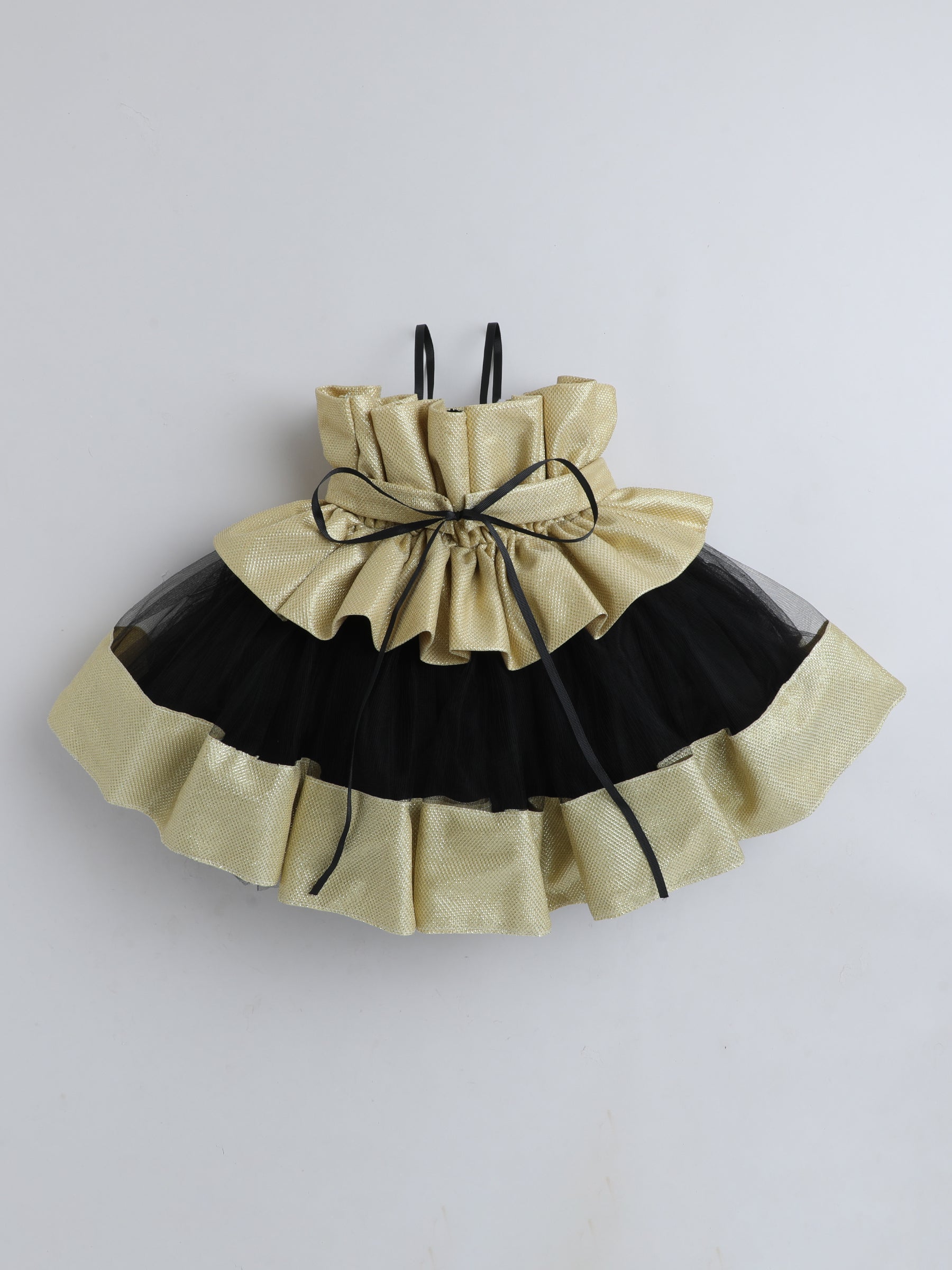 "Dreamy tutu gown featuring a shimmery bow belt, layered ruffles, and delicate straps – perfect for birthdays,