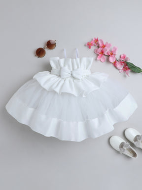 "Dreamy tutu gown featuring a shimmery bow belt, layered ruffles, and delicate straps – perfect for birthdays,