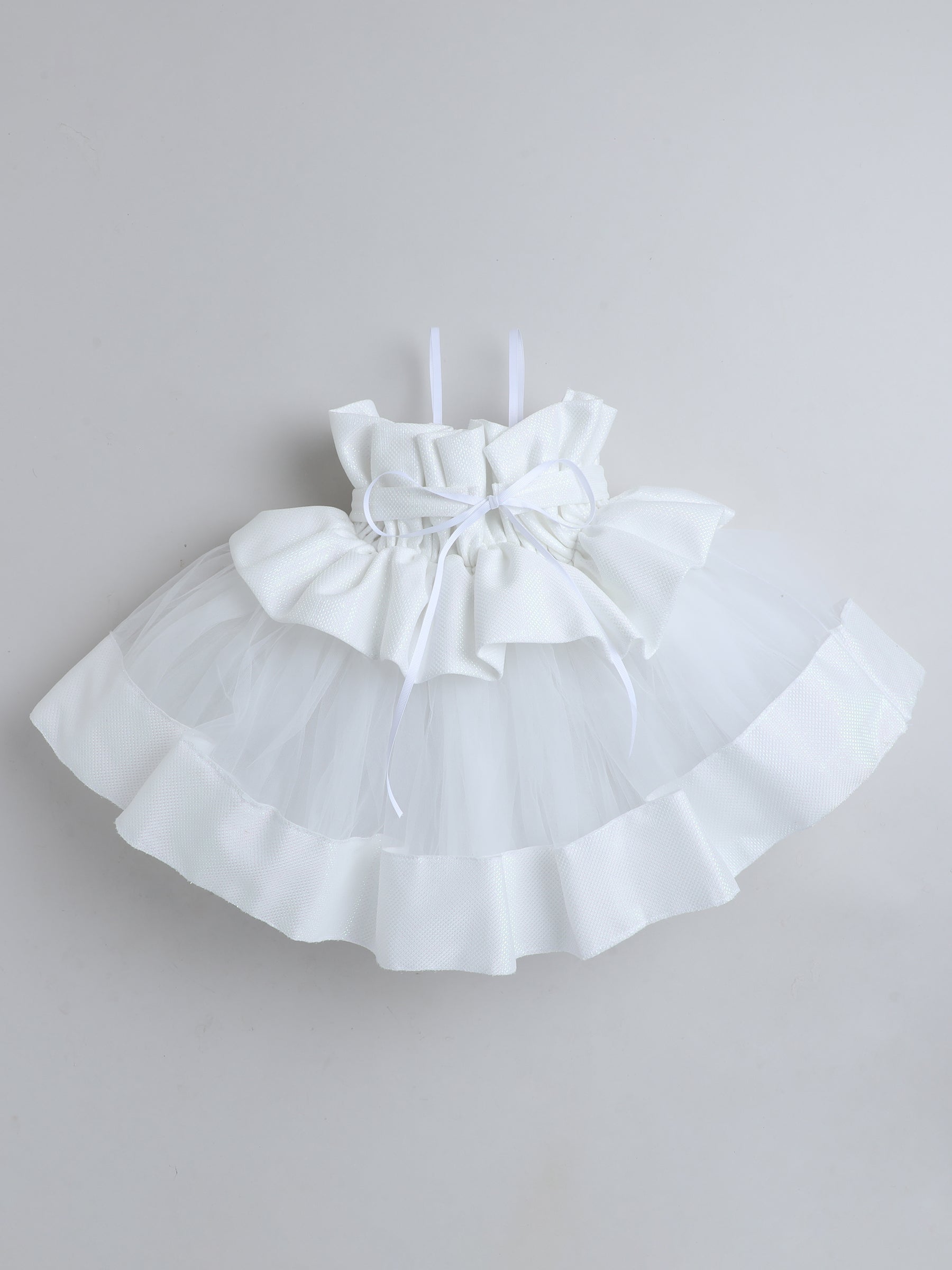 "Dreamy tutu gown featuring a shimmery bow belt, layered ruffles, and delicate straps – perfect for birthdays,