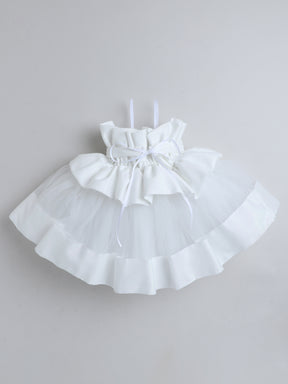 "Dreamy tutu gown featuring a shimmery bow belt, layered ruffles, and delicate straps – perfect for birthdays,