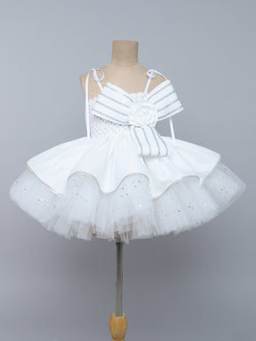 "Elegant white tutu gown with statement bow – perfect for birthdays & special occasions."