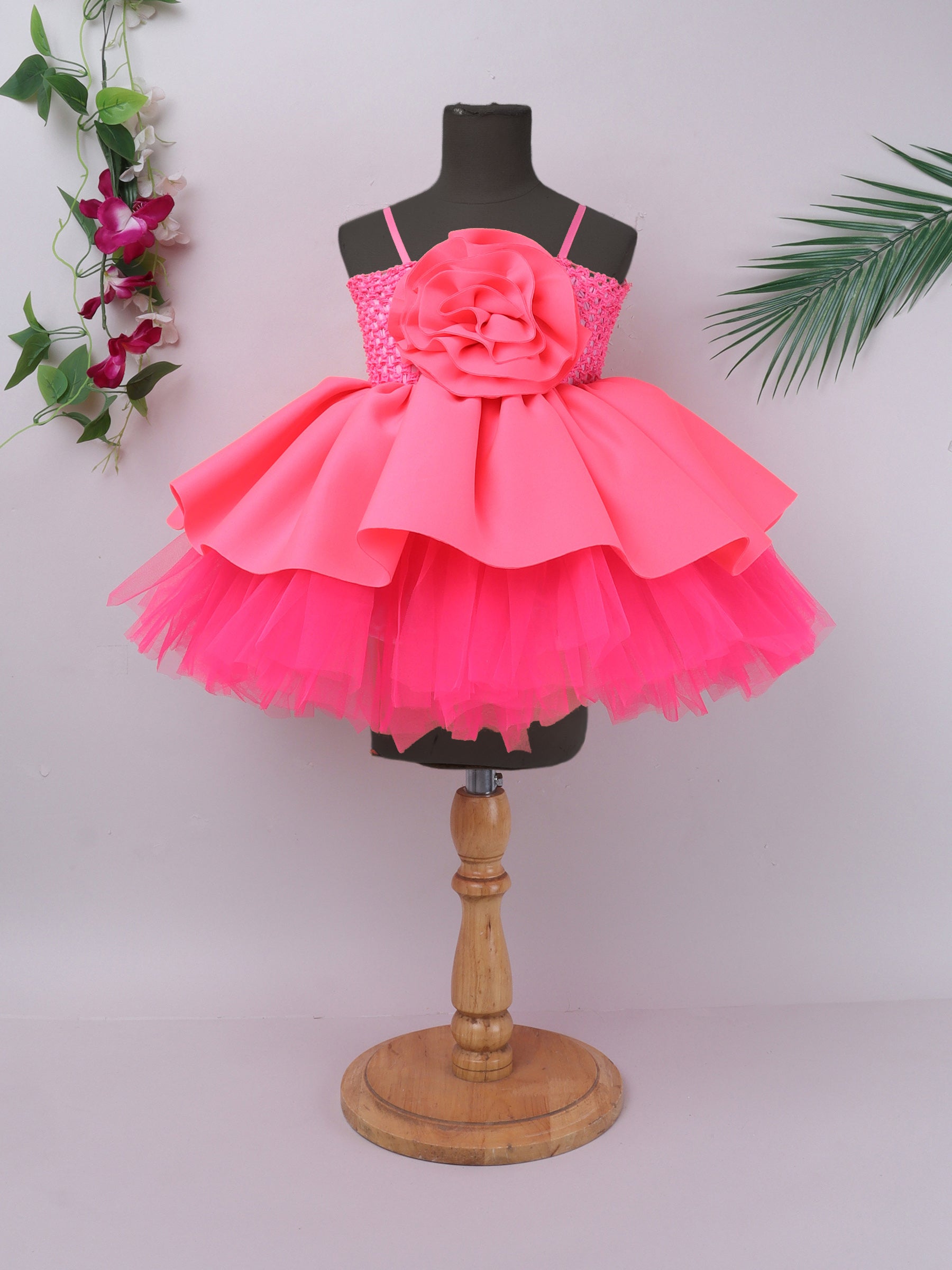 "Neon bloom tutu gown – bold flower accent and vibrant charm for your little star."
