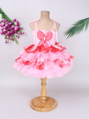"Layered Ruffle Tutu Gown – Striking floral design with a bold butterfly accent, perfect for special occasions."