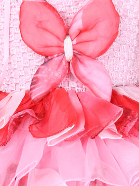 "Layered Ruffle Tutu Gown – Striking floral design with a bold butterfly accent, perfect for special occasions."