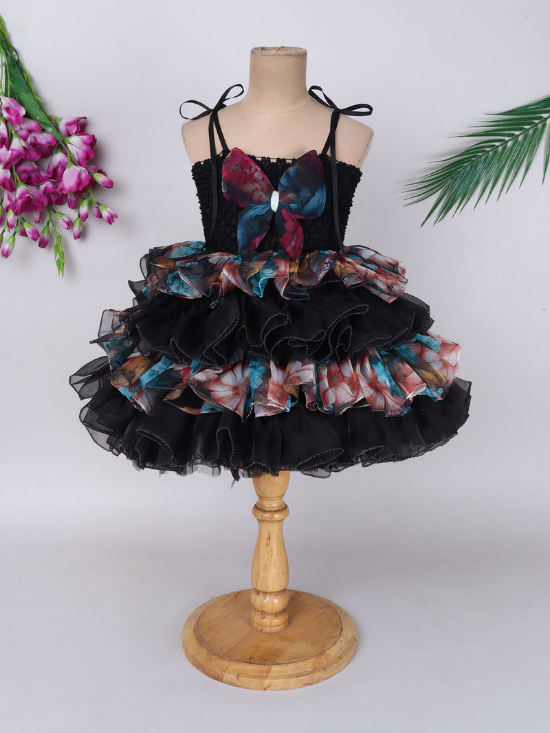 "Layered Ruffle Tutu Gown – Striking floral design with a bold butterfly accent, perfect for special occasions."