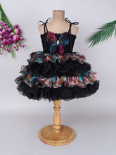 "Layered Ruffle Tutu Gown – Striking floral design with a bold butterfly accent, perfect for special occasions."