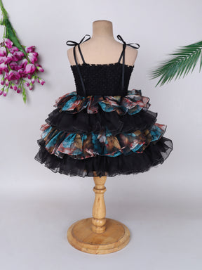 "Layered Ruffle Tutu Gown – Striking floral design with a bold butterfly accent, perfect for special occasions."