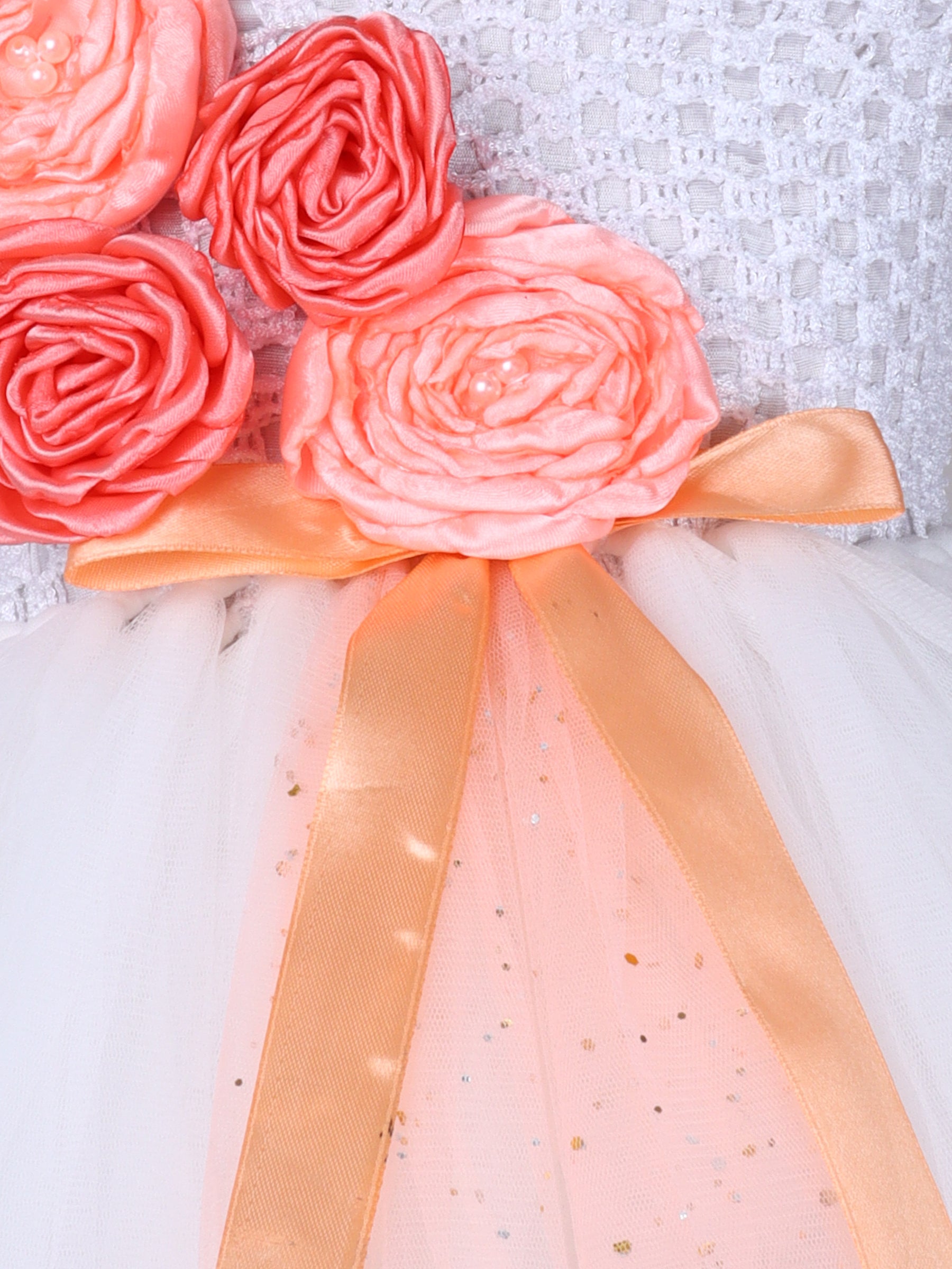 "One-shoulder peach bloom tutu gown with floral accents – perfect for special occasions."