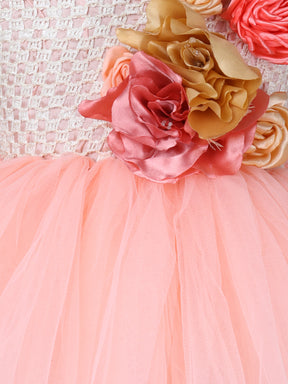 "Blush peach floral tutu gown – one-shoulder elegance for your little star."