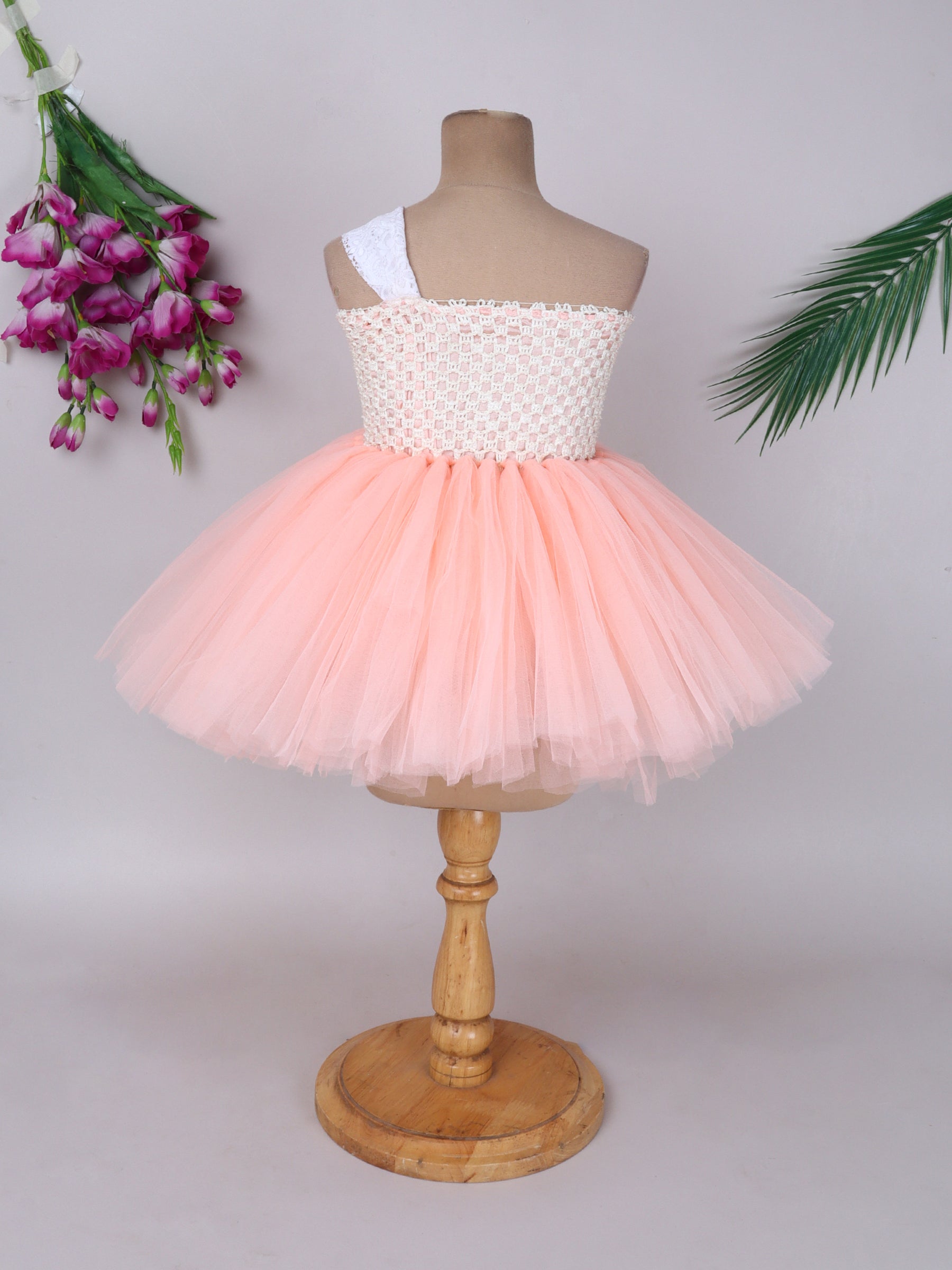 "Blush peach floral tutu gown – one-shoulder elegance for your little star."