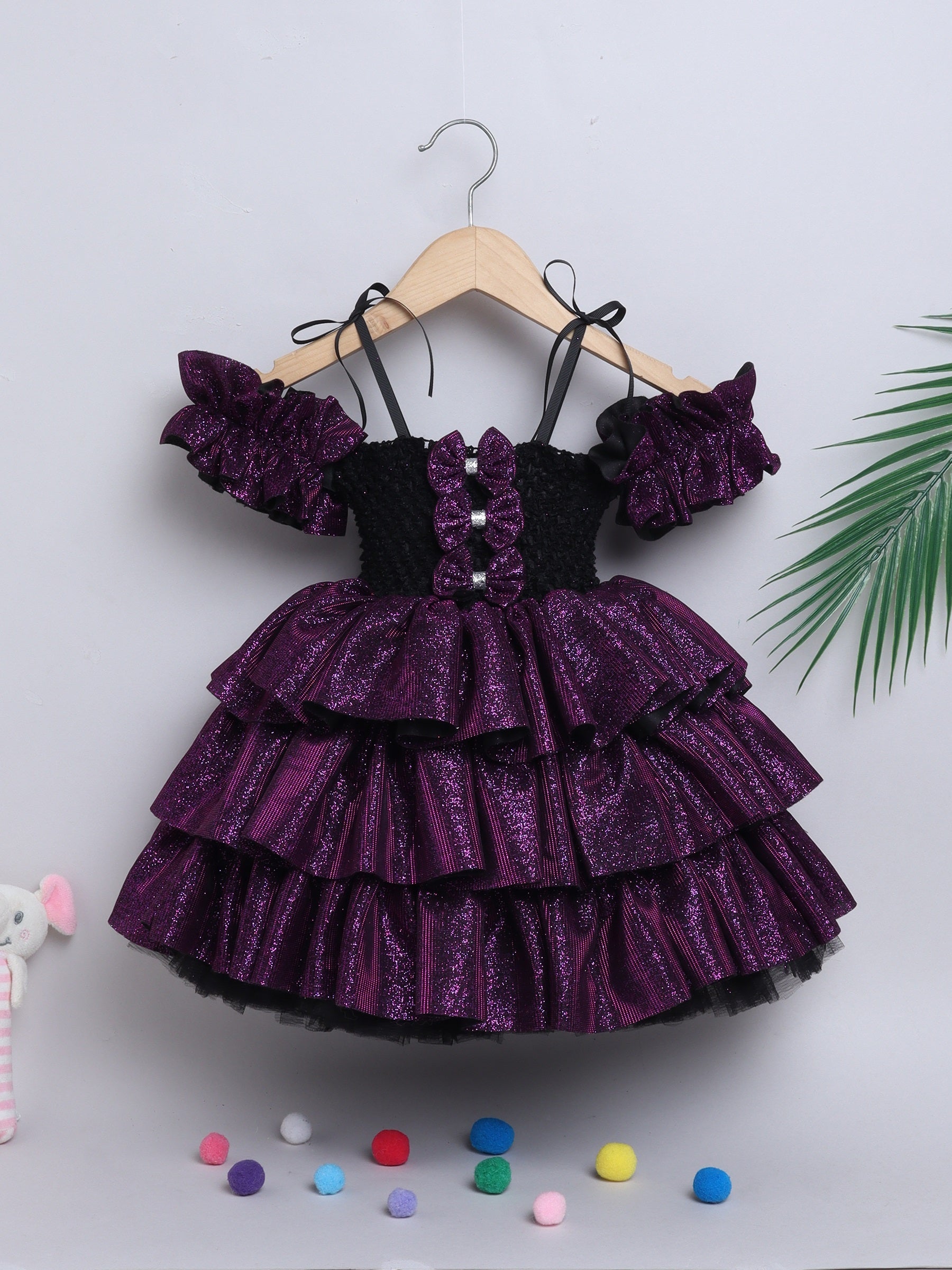 Sparkle layered tutu gown – trendy off-shoulder sleeves and ruffle detailing for a glamorous party look."