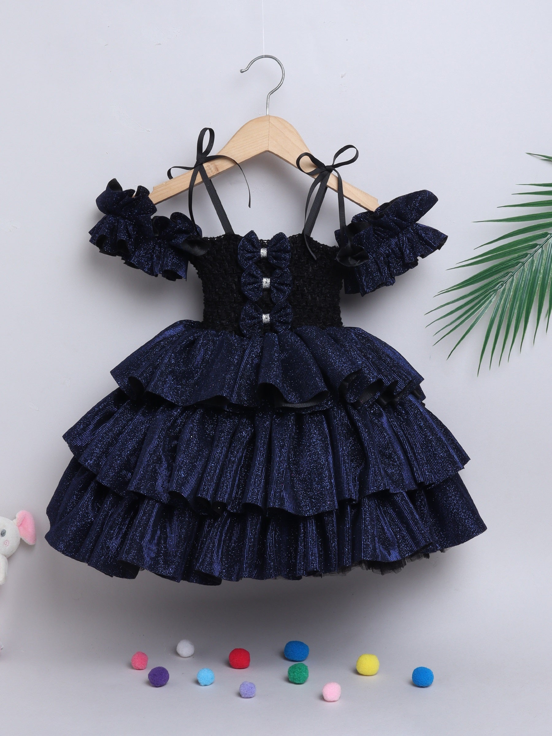 Sparkle layered tutu gown – trendy off-shoulder sleeves and ruffle detailing for a glamorous party look."