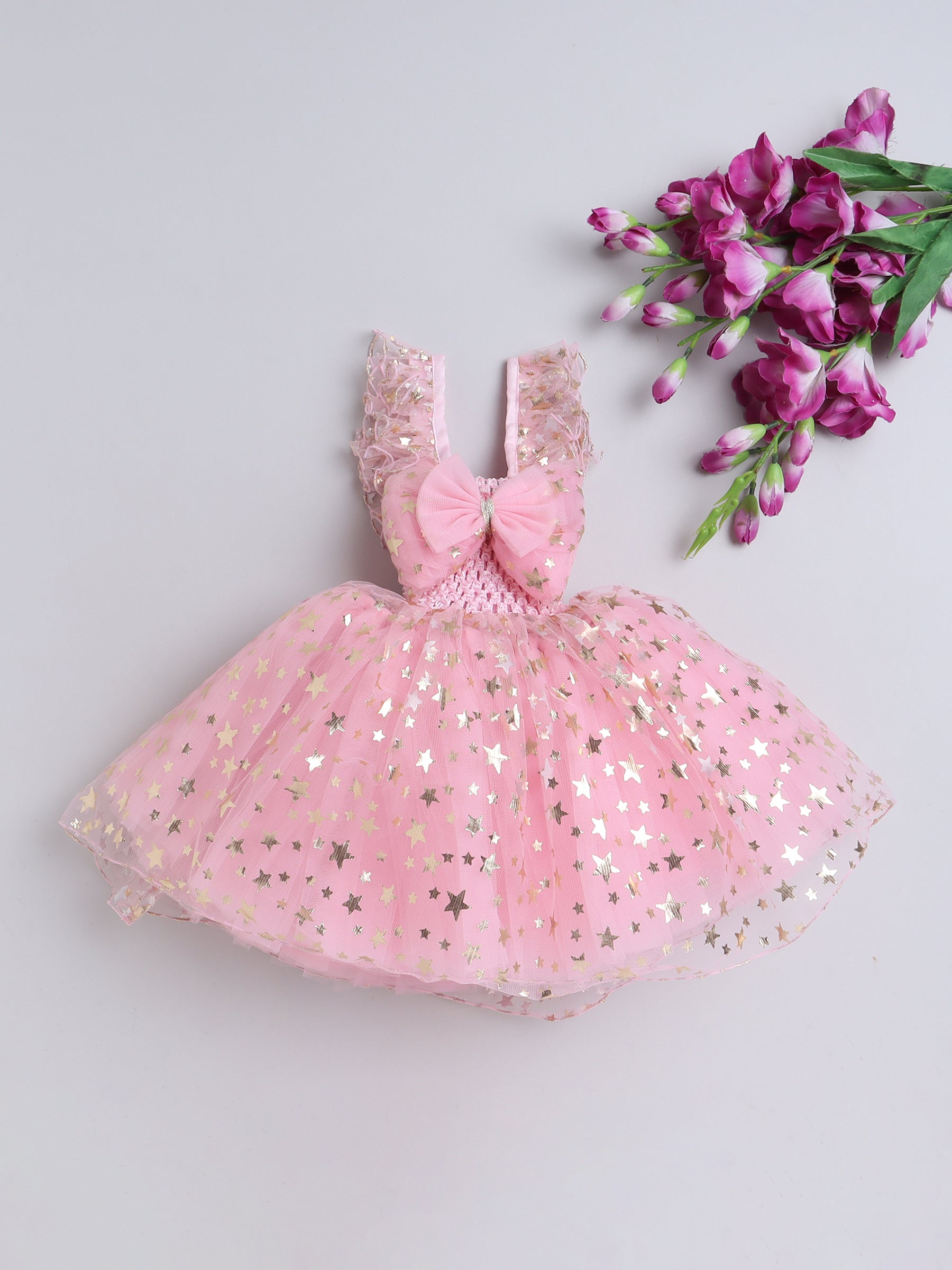Twinkle like a little star in this dreamy pink Knee Length dress sprinkled with golden magic!