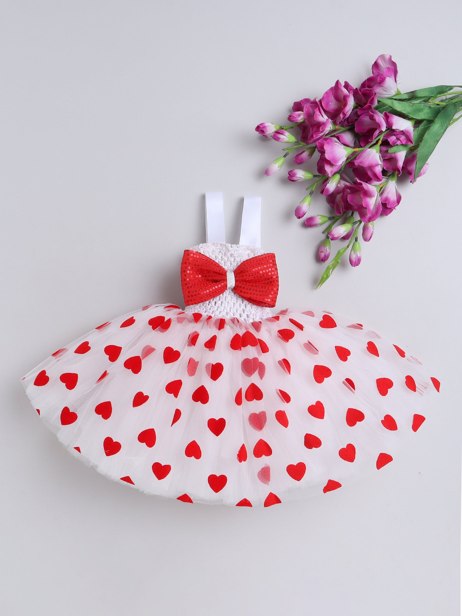 Bursting with love and charm — this heart-filled Knee Length dress is made for your little sweetheart’s special day!