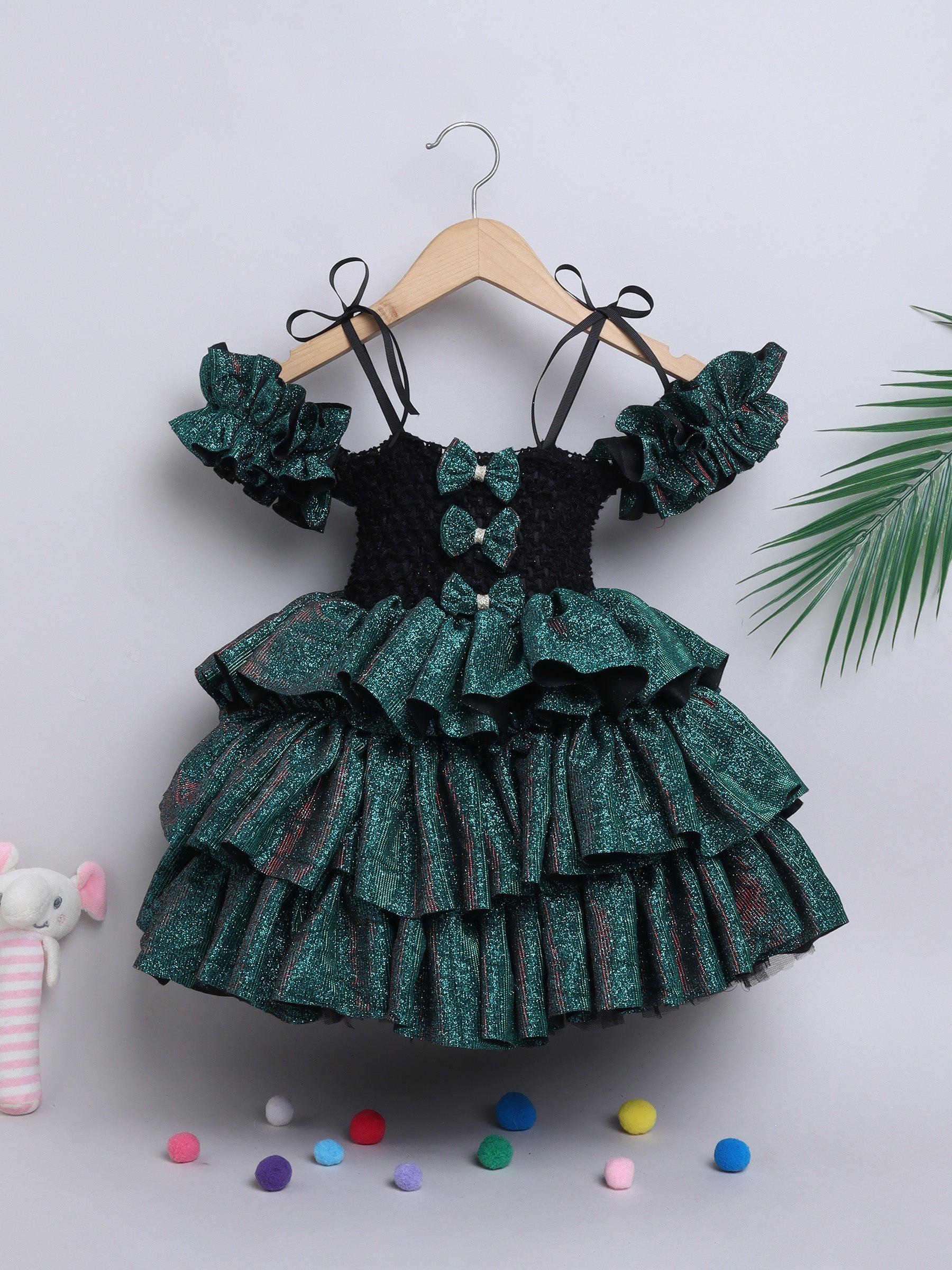 Sparkle layered tutu gown – trendy off-shoulder sleeves and ruffle detailing for a glamorous party look."