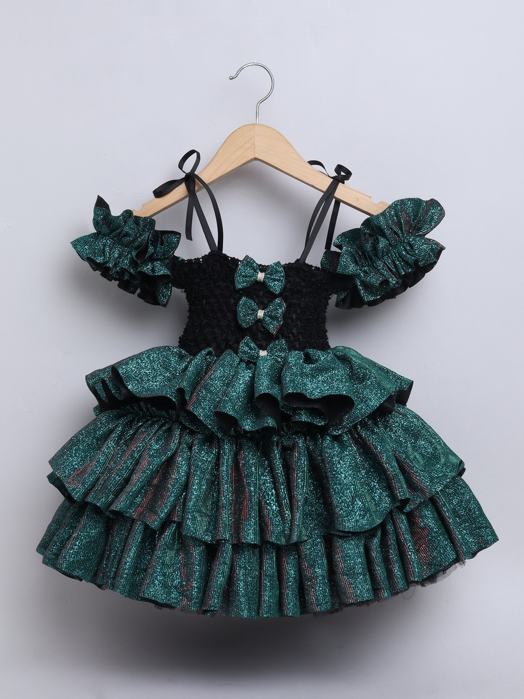 Sparkle layered tutu gown – trendy off-shoulder sleeves and ruffle detailing for a glamorous party look."