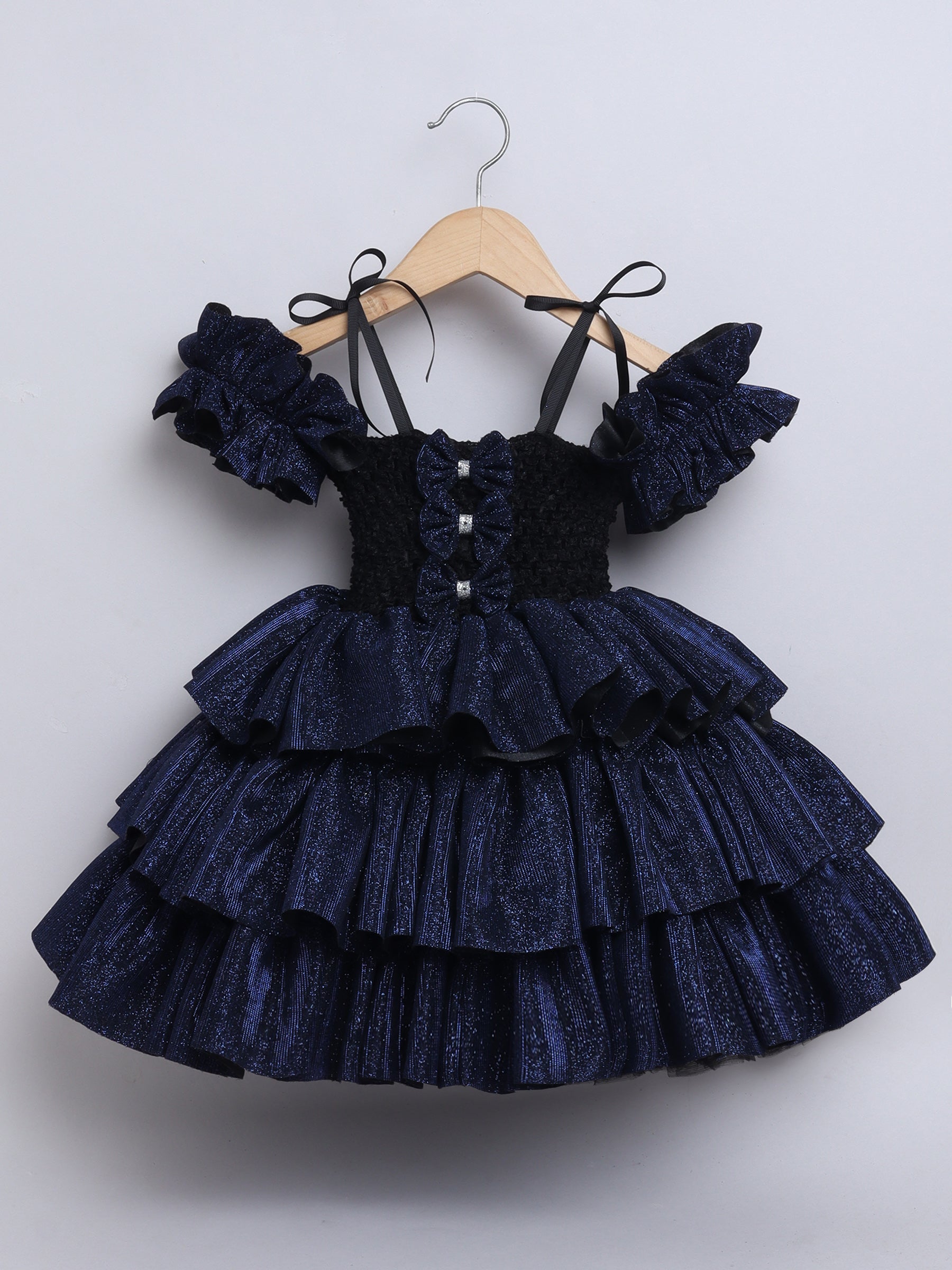 Sparkle layered tutu gown – trendy off-shoulder sleeves and ruffle detailing for a glamorous party look."