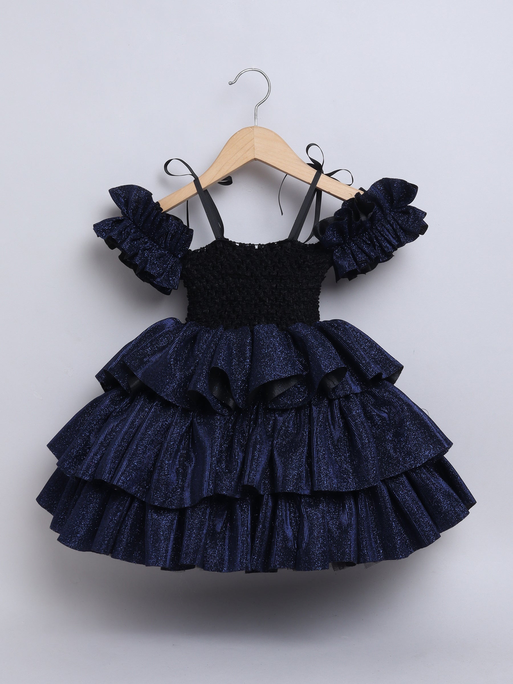 Sparkle layered tutu gown – trendy off-shoulder sleeves and ruffle detailing for a glamorous party look."