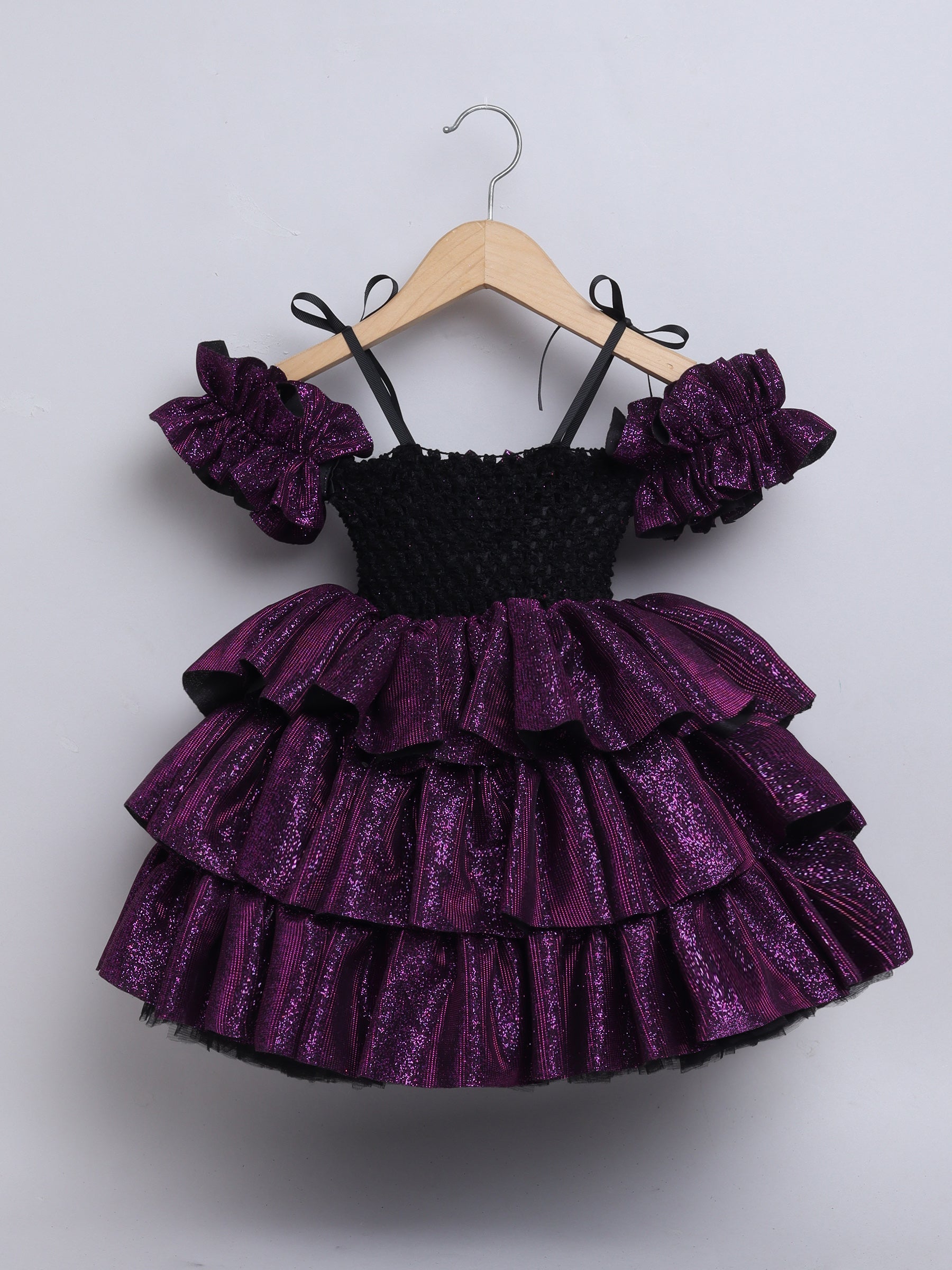 Sparkle layered tutu gown – trendy off-shoulder sleeves and ruffle detailing for a glamorous party look."